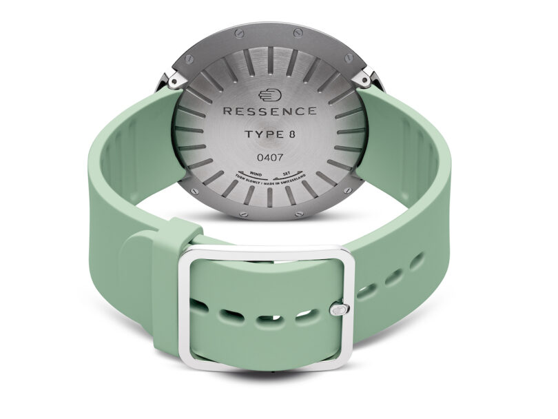 backside of A modern wristwatch with a turquoise strap