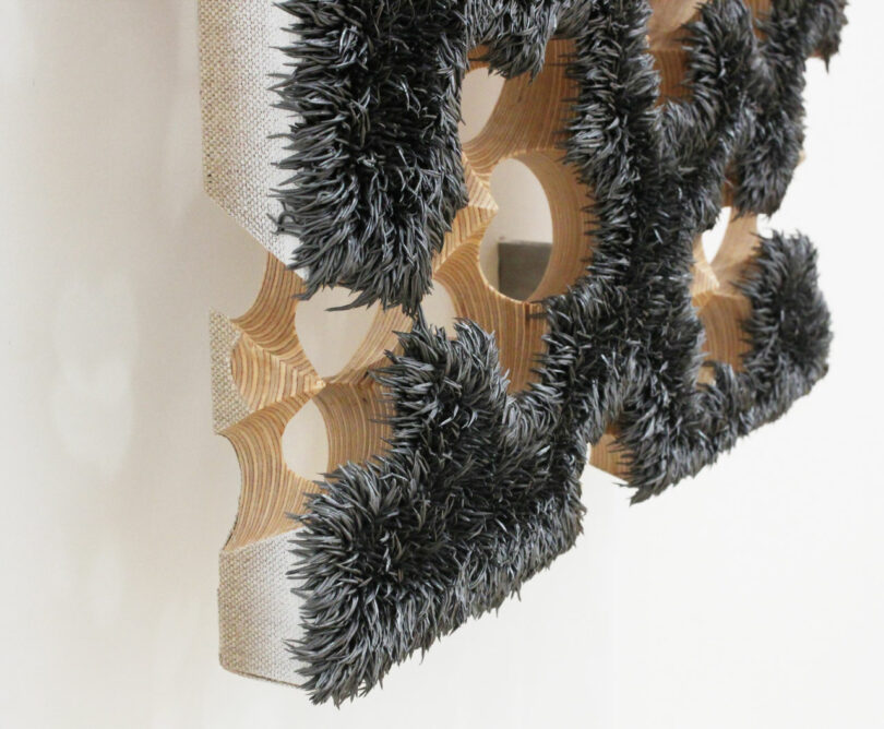 Close-up of corner of oil painting on carved plywood support