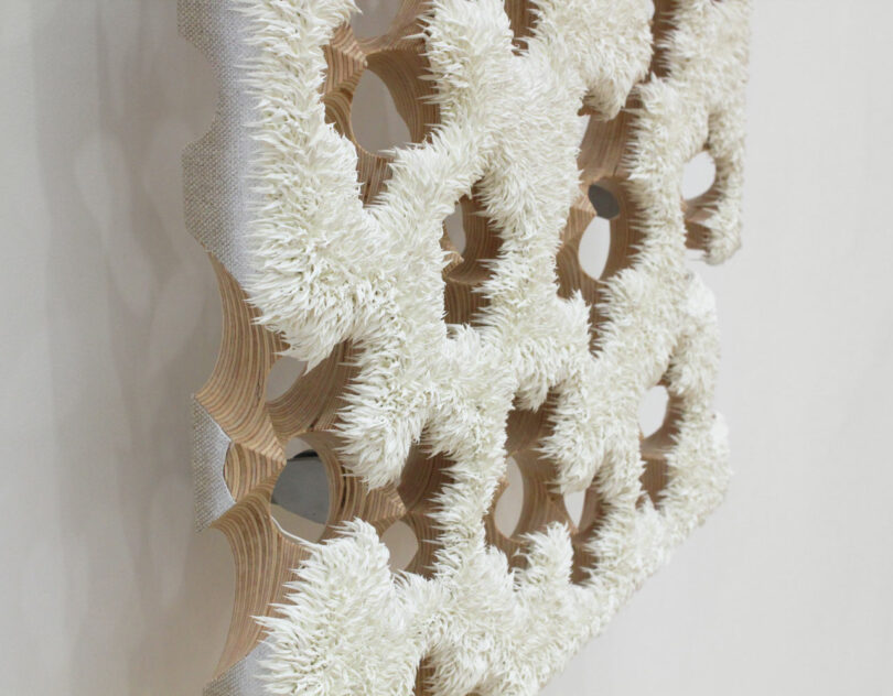 Painting suspended from wall