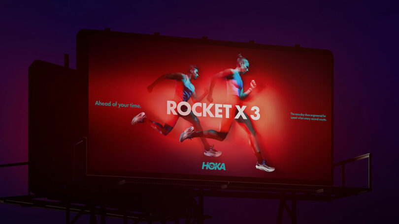 A billboard displays two runners in motion with the text "ROCKET X 3" and the HOKA logo on a red background, promoting running shoes.