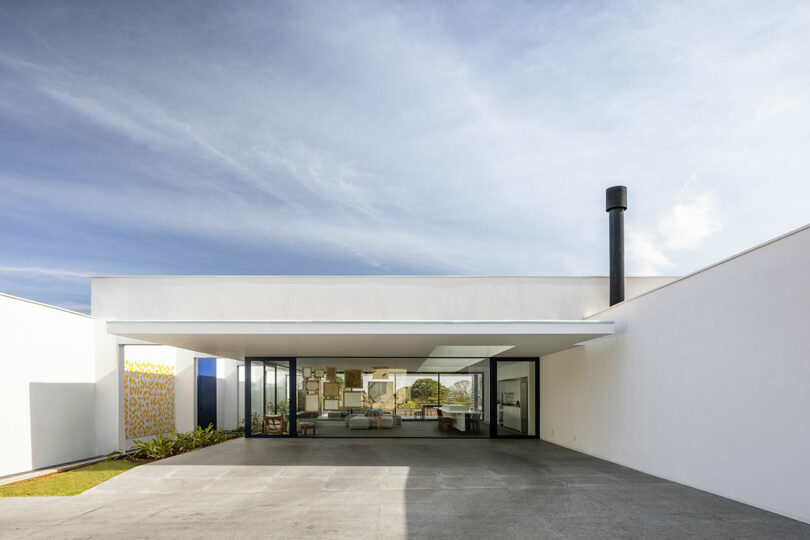 closeup partial exterior view of white rectilinear house